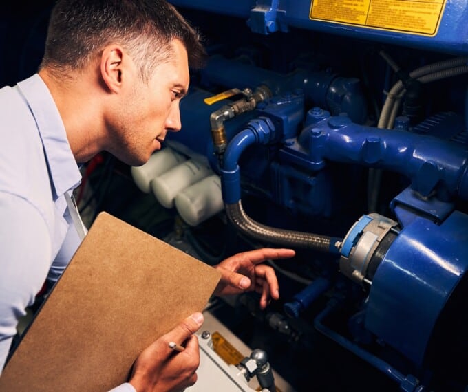 Engineer inspecting a industrial engine starter